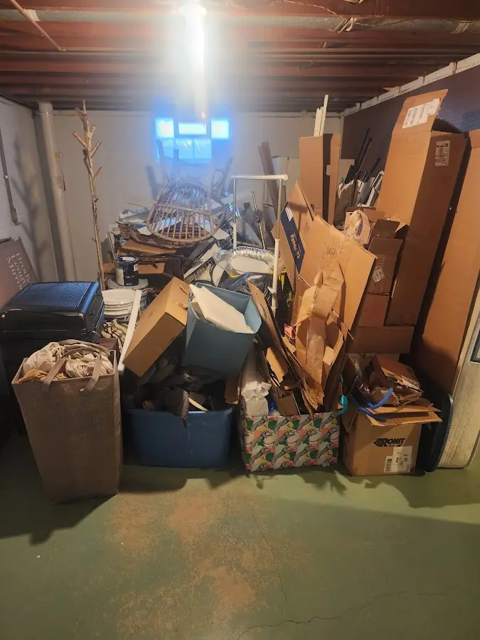 Roll-off dumpster container at job site for 2 Yard Dumpster Rental in Manor